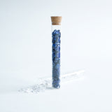 Gemstone chips  in a test tube