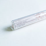 Gemstone chips  in a test tube